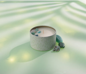 Bloom Candle Tin 6 oz | Aluminate Life with decorative stones on a soft green surface, highlighting a soothing and stylish wellness ambiance.