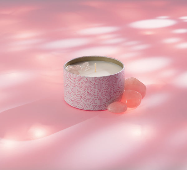 Sleep Candle Tin 6 oz | Aluminate Life in a patterned tin container with soothing pink crystals on a soft pink surface, promoting relaxation and wellness.