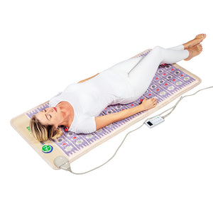 A woman in white activewear lying relaxed on the TAJ-Mat™ Full Short 6024 Firm - Photon PEMF InfraMat Pro® | HealthyLine wellness device designed for body care and recovery.
