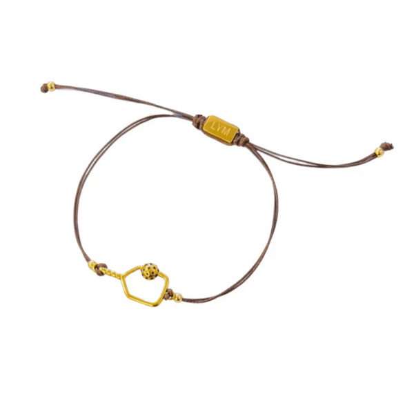 Brown adjustable cord bracelet featuring a gold-tone pickle ball charm and hexagonal frame, engraved with LVM on the clasp, Savannah Cord Bracelet with Pickle Ball | Love You More.