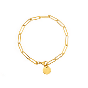 The Paperclip Bracelet (Gold) | Love You More featuring elegant gold paperclip links with a small round charm engraved with a subtle heart design.