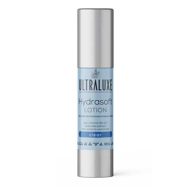 Hydrasoft Lotion - Clear | Ultraluxe Skincare bottle featuring a sleek silver cap and light blue label highlighting pro-vitamin B5, E, lavender extract, and antioxidant ceramides for balanced moisture.
