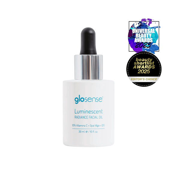 Bottle of LUMINISCENT Radiance Facial Oil | Glo910 with dropper cap, featuring awards for beauty excellence in skincare and radiance enhancement.