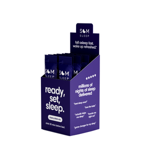 Display box of Sleep Aid Powder Drink Mix 15 pk - Cherry | Som Sleep in purple packaging featuring text about falling asleep fast and customer reviews for wellness supplements.