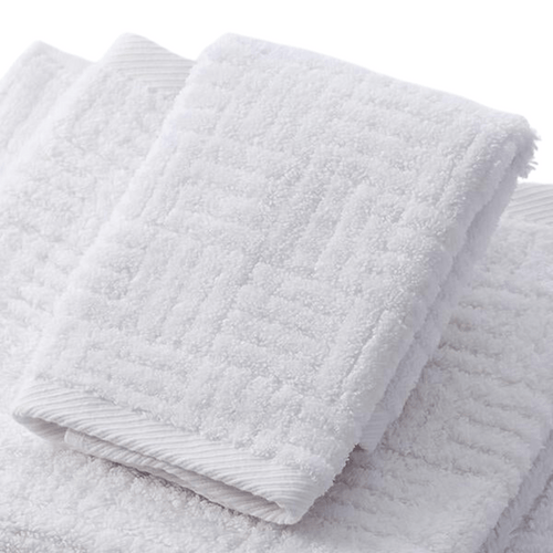 Soft white towel with textured pattern made from Hotel Collection Organic Cotton | TOWL, designed for ultimate comfort and sustainable body care.