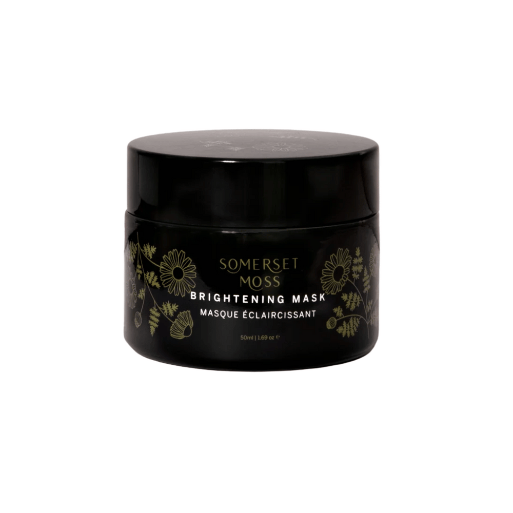 Black jar of Brightening Mask | Somerset Moss with gold floral design, promoting skincare and wellness in an elegant container.