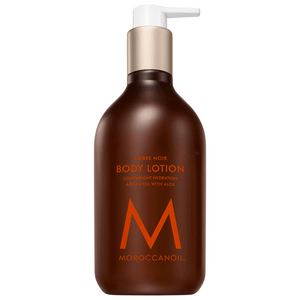 Bottle of Body Lotion | Moroccanoil in a dark amber pump container featuring lightweight hydration with argan oil and aloe for nourishing skincare.