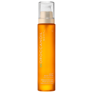 Bottle of Night Body Serum | Moroccanoil in amber packaging with a pump dispenser, designed for skincare and body care to firm and smooth the skin.