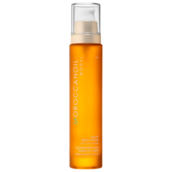 Bottle of Night Body Serum | Moroccanoil in amber packaging with a pump dispenser, designed for skincare and body care to firm and smooth the skin.
