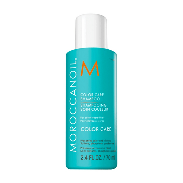 Bottle of Color Care Shampoo - Travel | Moroccanoil in turquoise packaging with white and orange text designed for color-treated hair, preserving color and vibrancy.