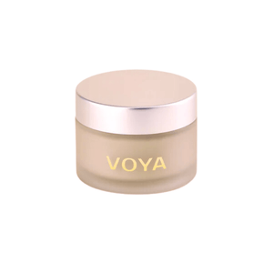 Jar of Get Glowing Illuminating Clay Mask | VOYA, a skincare product in a frosted container with a metallic lid, designed to enhance skin radiance.