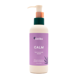 A bottle of Hand & Body Wash | Latika with a calming lavender and peppermint scent, featuring a purple label and a pump dispenser for easy use in skincare and body care routines.