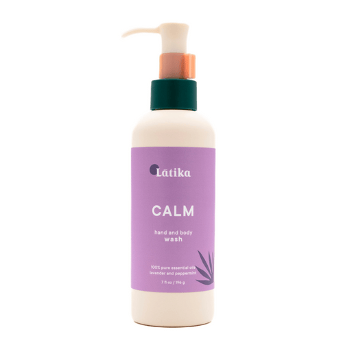 A bottle of Hand & Body Wash | Latika with a calming lavender and peppermint scent, featuring a purple label and a pump dispenser for easy use in skincare and body care routines.