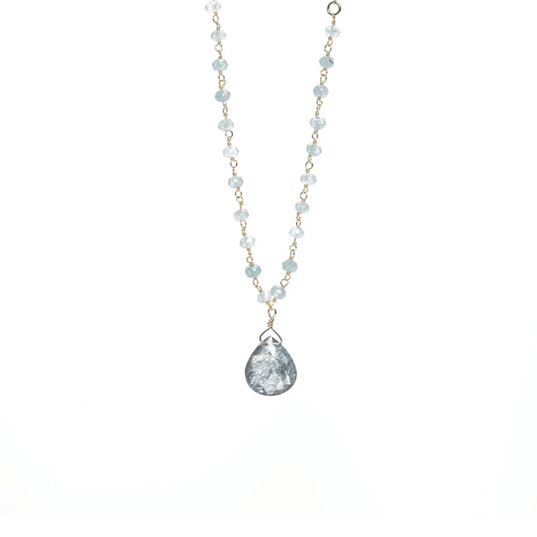 Delicate necklace featuring light blue beads and a teardrop-shaped pendant with a textured surface, designed as the Alice Rosary Necklace | Liv & B.