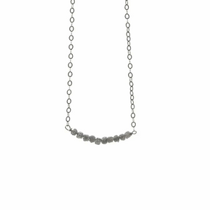 Diamonds In The Raw Sterling Silver Necklace | Liv & B featuring a delicate silver chain with a row of raw, uncut diamond stones for a natural, elegant look.