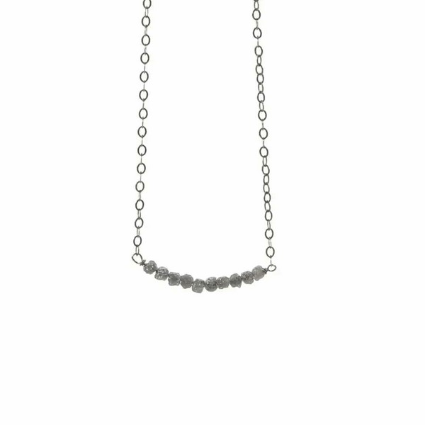 Diamonds In The Raw Sterling Silver Necklace | Liv & B featuring a delicate silver chain with a row of raw, uncut diamond stones for a natural, elegant look.