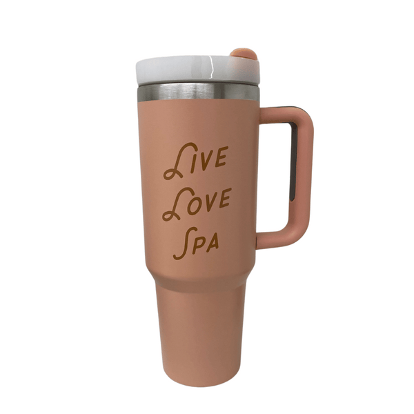 Live Love Spa Retro 40 oz Tumbler | Live Love Spa in matte pink with a white lid, featuring a comfortable handle and branded text on the front for wellness and hydration.