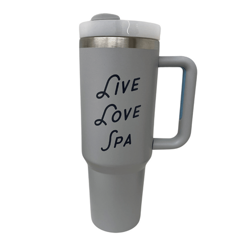 Gray insulated travel mug with handle and white lid featuring the text "Live Love Spa" in stylized font, designed for wellness and hydration, called Live Love Spa Retro 40 oz Tumbler | Live Love Spa.