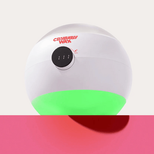 The Meltdown Machine Wax Warmer | Crybaby Wax, a sleek white skincare device with digital temperature control and a glowing green base, designed for efficient body care wax warming.
