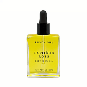 Lumière Body Glow Oil - Rose | French Girl in a clear rectangular glass bottle with black dropper cap, showcasing golden yellow body care oil for glowing skin and skincare wellness.