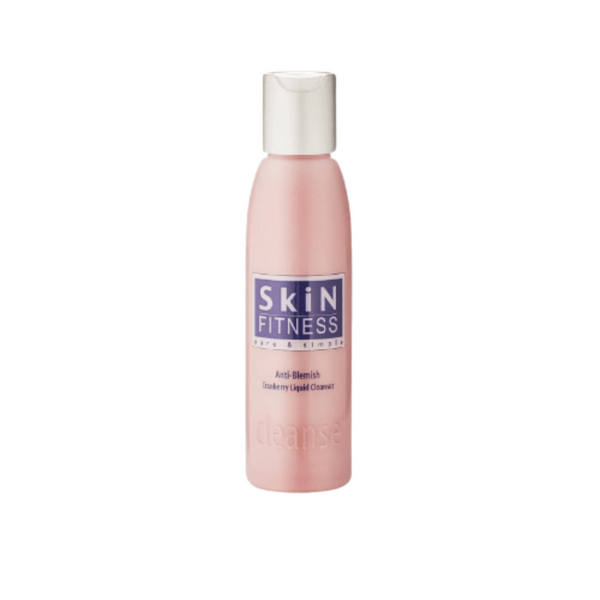 Bottle of AntiBlemish Cleanser | Skin Fitness Therapy in soft pink packaging designed for skincare and blemish control.