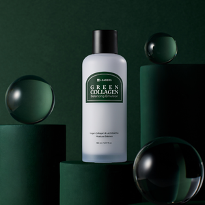 Bottle of Green Collagen Balancing Emulsion | Leaders displayed on dark green cylindrical platforms with reflective glass spheres, highlighting skincare and wellness.