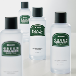 Several frosted bottles of Green Collagen Synergy Toner | Leaders with black caps arranged on a white surface, highlighting skincare and hydration benefits.