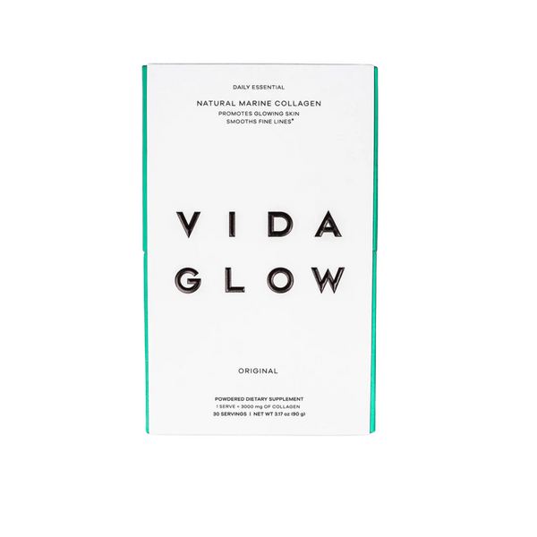 White and teal packaging of Natural Marine Collagen | VIDA GLOW, a powdered dietary supplement promoting glowing skin and smoothing fine lines for skincare and wellness.