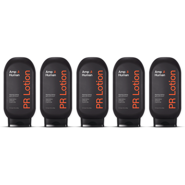 Five black bottles of Amp Human PR Lotion arranged in a row, showcasing the "PR Lotion® Buy 4, Get 1 Free. $175 Value" offer for skincare and body care.