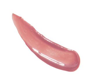 Glossy swatch of Vitamin Glaze® Oil Infused Lip Gloss – Delicate Rose | Farmhouse Fresh showing a sheer, soft pink shade with a smooth, moisturizing finish.