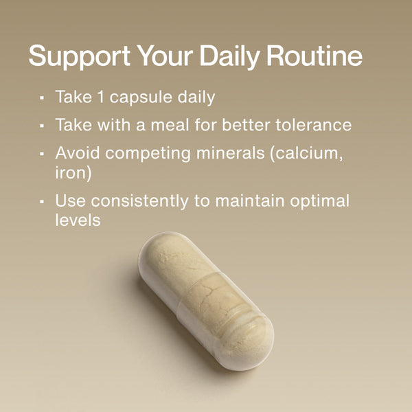 Close-up of a single capsule supplement on a beige background with text explaining how to use Zinc daily by taking one capsule with a meal and avoiding competing minerals for optimal wellness.