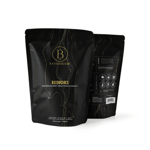Black resealable pouches of Hinoki Cypress Magnesium Bath Flakes | Bathorium with gold and white text, highlighting wellness and skincare benefits for a spa-like experience.