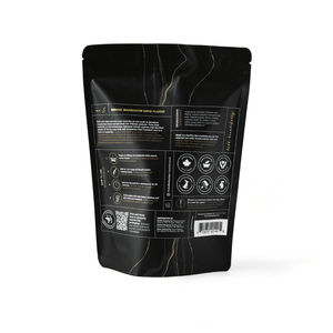 Back of packaging for Hinoki Cypress Magnesium Bath Flakes | Bathorium showing usage instructions, safety icons, and product details on a black resealable pouch.