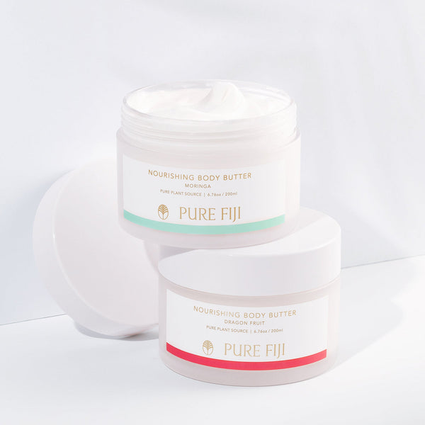 Two jars of Nourishing Body Butter | Pure Fiji with one open showing creamy texture, featuring Moringa and Dragon Fruit varieties.