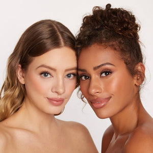 Two women with flawless skin and natural makeup posing closely together showcasing beauty and confidence for Lashies™ - Wifey - On The Go | Moxielash.