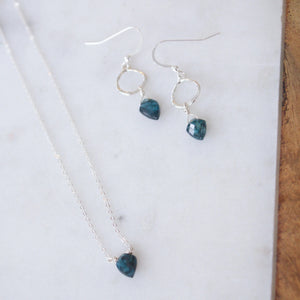 Insightful Teal Kyanite Sterling Silver Necklace | Liv & B displayed with matching sterling silver earrings featuring teal kyanite stones on a light marble surface