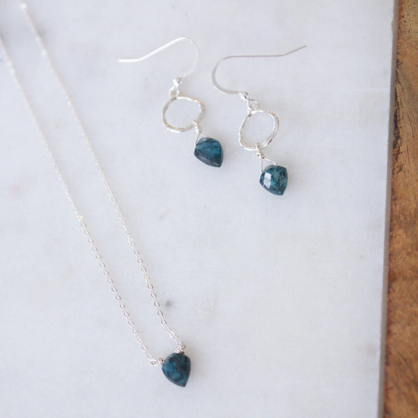 Insightful Teal Kyanite Sterling Silver Necklace | Liv & B displayed with matching sterling silver earrings featuring teal kyanite stones on a light marble surface