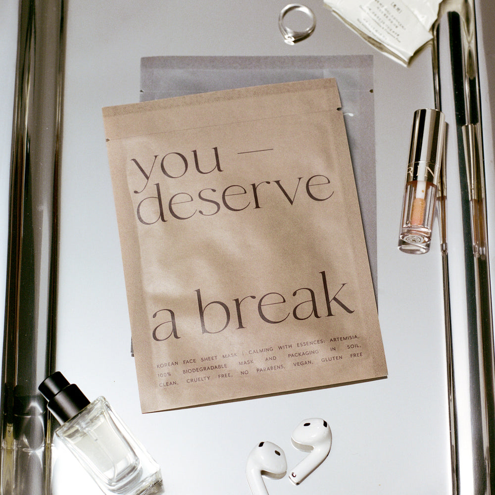 Korean Sheet Mask - You Deserve a Break | Lucky Owl packaging in natural brown with minimalist black text, promoting a biodegradable, vegan, cruelty-free skincare product for wellness and anti-aging.