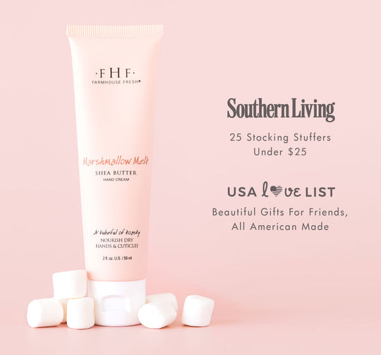 Tube of Marshmallow Melt Hand Cream | Farmhouse Fresh surrounded by white marshmallows on a soft pink background with promotional text for gift ideas and stocking stuffers under $25