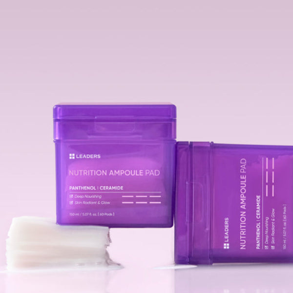 Two purple containers of Nutrition Ampoule Pad | Leaders with white skincare pads beside them on a soft lavender background, highlighting skincare and nourishing body care.