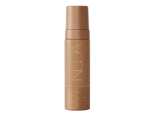 Bottle of Self Tanning Mousse | NUDA in a sleek, matte brown container designed for skincare and body care, promoting a natural sun-kissed glow.