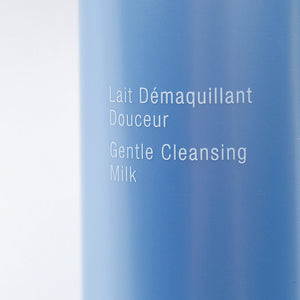 Close-up of blue skincare bottle labeled with "Gentle Cleansing Milk" featuring the product Perfect Visage Gentle Cleansing Milk | Phytomer, highlighting gentle facial cleansing for skincare.