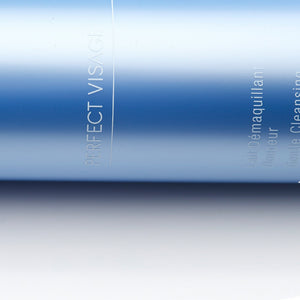 Close-up of a sleek blue bottle labeled Perfect Visage Gentle Cleansing Milk | Phytomer, designed for skincare and cleansing.
