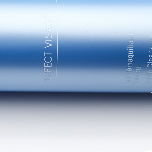 Close-up of a sleek blue bottle labeled Perfect Visage Gentle Cleansing Milk | Phytomer, designed for skincare and cleansing.