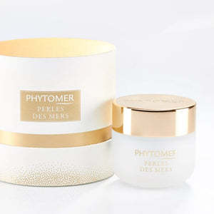Perles Des Mers Longevity Cream | Phytomer in a frosted glass jar with gold lid next to a matching white and gold decorative packaging, showcasing premium skincare.