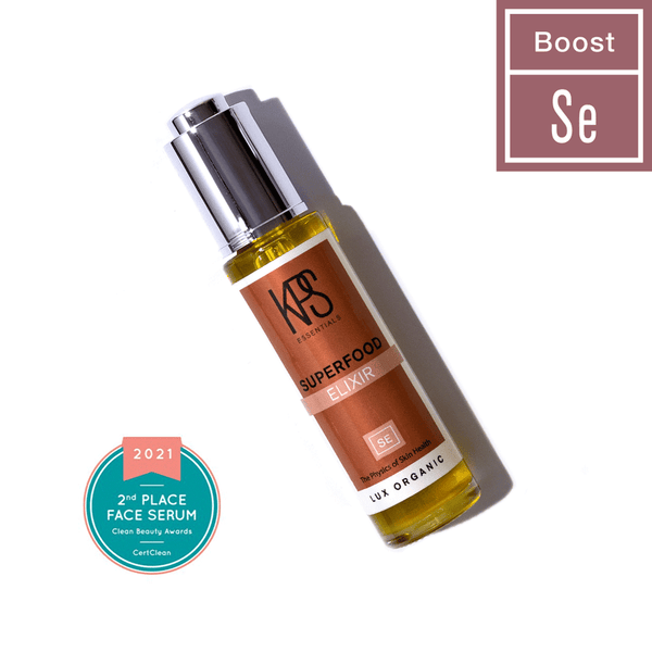 Glass dropper bottle of Superfood Elixir | Kindness Powered Skincare face serum with a clean beauty award badge for 2nd place in 2021, highlighting organic skincare benefits.