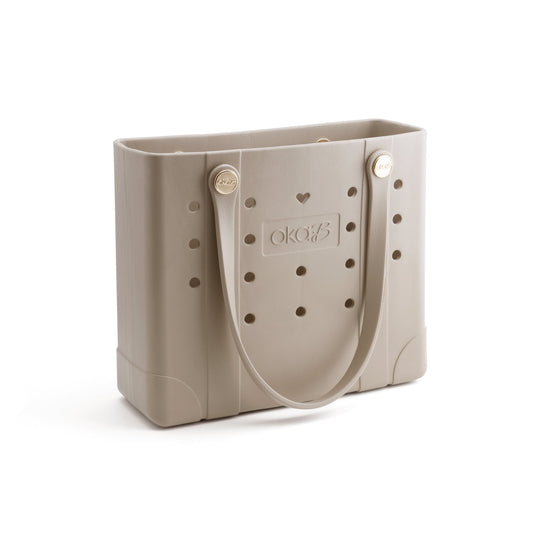 Tori Everywhere Tote Bag | Oka-B in a neutral chai color, featuring durable material, functional perforations, and comfortable handles for everyday wellness and body care essentials.