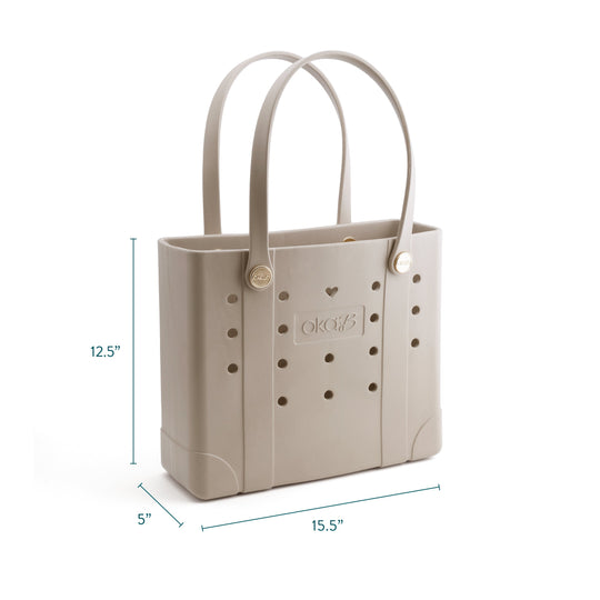 Tori Everywhere Tote Bag | Oka-B in a neutral beige color with two shoulder straps, perforated design, and a structured rectangular shape ideal for casual or beach use.
