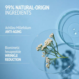 Close-up of a small white flowering plant on a blue surface with text highlighting natural-origin ingredients and anti-aging benefits, related to Kit Italian Garden | [ comfort zone ].
