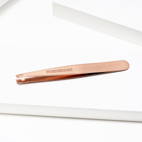 Rose Gold Slant Tweezer | Tweezerman with a sleek, durable metal design ideal for precise eyebrow shaping and grooming in skincare routines.